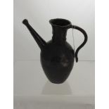 An Antique Bronze Ewer, with incised curved handle and straight spout, possibly 17th Century North