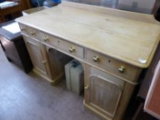 An Antique Waxed Pine Desk, the desk having three drawers top with cupboards beneath, approx 122 x