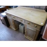 An Antique Waxed Pine Desk, the desk having three drawers top with cupboards beneath, approx 122 x