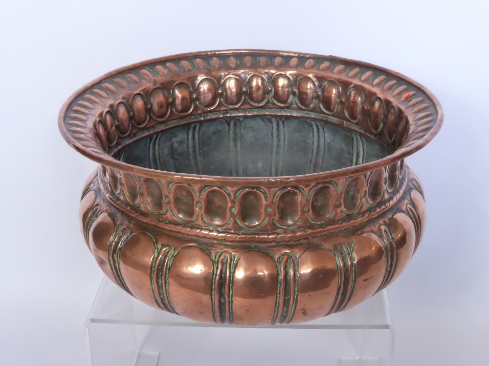 An Antique Rose Copper Jardiniere, decorative moulding to the bowl, approx 36 x 36 cms.