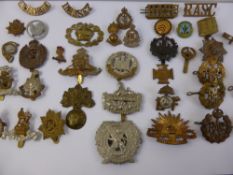 A Quantity of Original WWI and WWII Period Military Cap Badges, including Gloucester's,