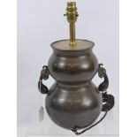 A Chinese Bronze Double Gourd Vase converted to a lamp base.