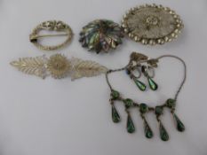 A Miscellaneous Collection of Brooches, including Mother of Pearl, Filligree and Celtic design