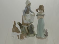 Two Lladro Figurines depicting Girls with Pets approx 23 cms high together with a figure of a