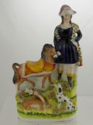 A 19th Century Staffordshire Flatback Figure, depicting a Highland lady with pony and deer in the