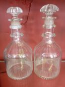 A Pair of Georgian Cut Glass Decanters, the decanters having ribbed base with star form stoppers and