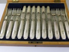 A Set of Silver Plated Knives and Forks, in the original presentation box together with a set of