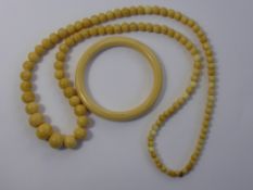 An Antique Graduated Ivory Necklace and bangle.