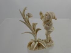 An Antique Ivory Figure of a Gnome, approx 8 cms high.