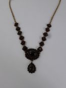 A Lady's Vintage Liberty of London 9 ct Gold and Garnet Drop Necklace, the necklace having six