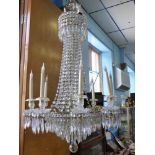 An Elegant Antique Gilded Brass Eight Branch Crystal Chandelier, wire conversion.