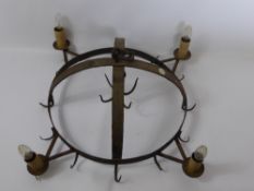 An Antique (Miniature) Cast Iron Game Crown, with candle sconces and game hooks.