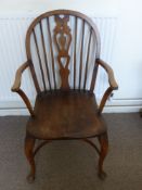 An Oak Carved Windsor Chair, together with a mahogany piano stool with a quantity of sheet music and