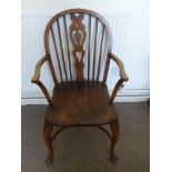 An Oak Carved Windsor Chair, together with a mahogany piano stool with a quantity of sheet music and