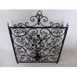 A Wrought Iron Fire Screen, of decorative floral design, approx 75 x 102 cms