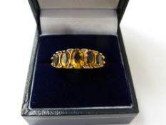 A Lady's Scroll Mount 9 ct Gold Topaz Ring, size P, approx 4.5 gms.