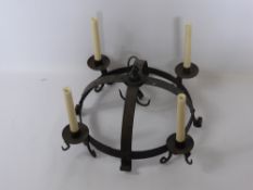 An Antique (Medium) Cast Iron Game Crown, with candle sconce and game hooks.
