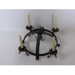 An Antique (Medium) Cast Iron Game Crown, with candle sconce and game hooks.