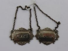 A Pair of Solid Silver Port and Brandy Labels. (2)