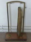 An Antique Brass and Oak Dinner Gong, approx 83 x 50 cms.