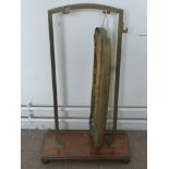 An Antique Brass and Oak Dinner Gong, approx 83 x 50 cms.