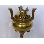 An Antique Brass Chinese Style Censer having a Dog of Fo finial with decorative tripod base and swan