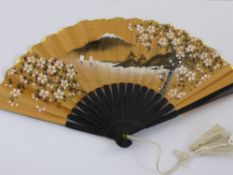 Three Lady's Japanese Fans, including a black lacquer fan hand painted with cherry blossom and a