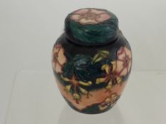 A Moorcroft Ginger Jar, "Clematis", nr C93 with impressed marks to base, signed J.M, approx 16 cms