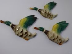 A Set of Ceramic Mallard Ducks in Flight. (3)