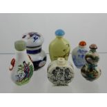 A Collection of Oriental Perfume Bottles, hand painted with various scenes.