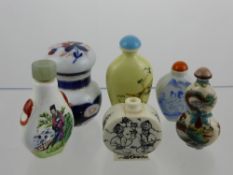 A Collection of Oriental Perfume Bottles, hand painted with various scenes.