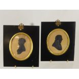 A Pair of Georgian Silhouettes, presented in ebony frames depicting a lady and gentleman, approx 9 x