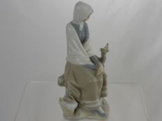 A Lladro Figure of a Seated Girl, approx 30 cms high.
