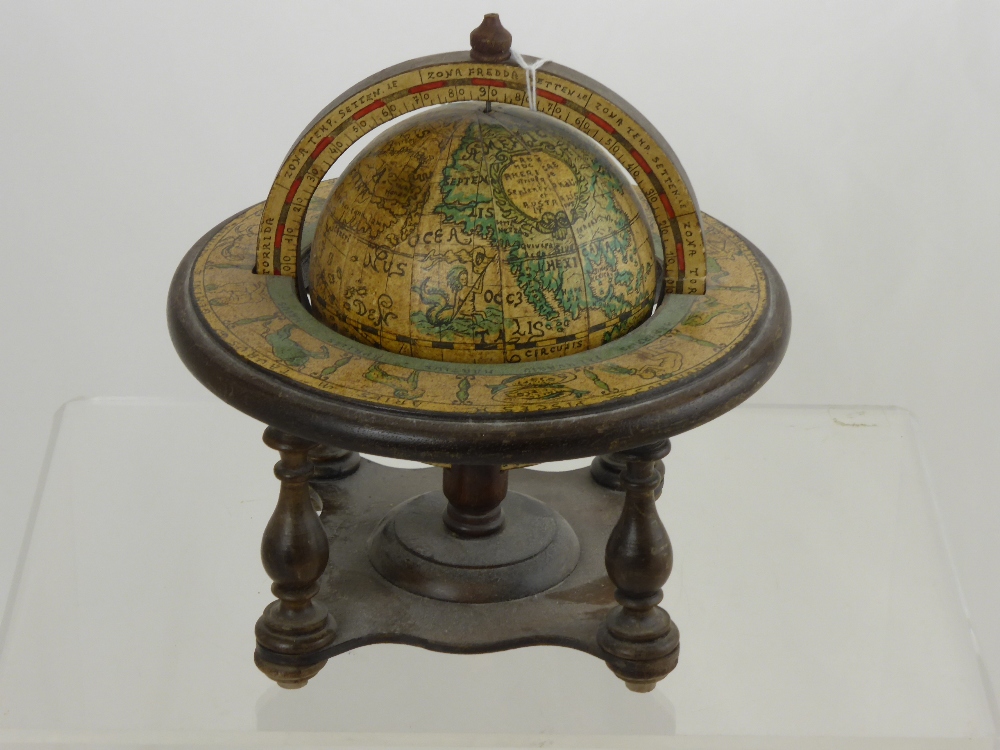 A Miniature Wooden Astrological Globe, the globe having the astrological signs the months written in