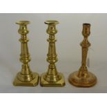 A Pair of 19th Century Brass Candlesticks, together with one other. (3)