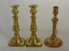 A Pair of 19th Century Brass Candlesticks, together with one other. (3)