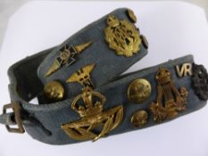 A Royal Airforce Trophy belt with mostly WW2 period insignia, Canadian, Australian and UK badges