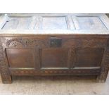 A Circa 18th Century Oak Chest, the having a carved panelled front with inlayto bottom, on