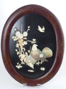A Pair of Oval Oriental Ivory and Mother of Pearl Naturalistic Wall Plaques, the plaques depicting
