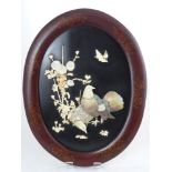 A Pair of Oval Oriental Ivory and Mother of Pearl Naturalistic Wall Plaques, the plaques depicting