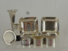 Three Solid Silver Napkin Rings, together with a silver bud vase, silver miniature photo frame,