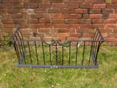 A Rectangular Iron Club Fender approx 134 cms wide x 49 cms high, scroll decoration to front.