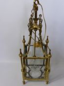 A Brass and Glass Ceiling Lantern, with decorative brass finial's and star engraving to each glass