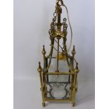 A Brass and Glass Ceiling Lantern, with decorative brass finial's and star engraving to each glass