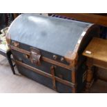 A Vintage Steamer Trunk with leather handles and fittings.