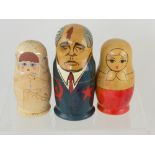 Three Semenov Russian Dolls, two depicting ladies and the third a Pugachev character.