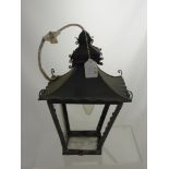 A wrought iron coaching lamp.