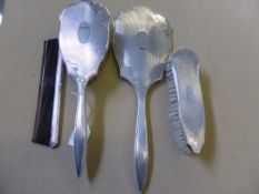 A Solid Silver Dressing Table Set, comprising hand mirror, clothes brush, hair brush and comb,