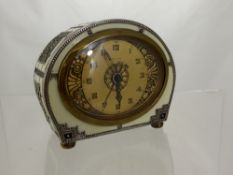 A Haller Brass and Enamel Chime/Alarm Clock.