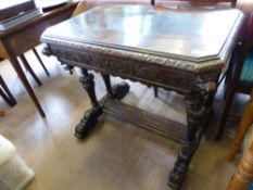 An Antique Stained Oak Jacobean Style Hall Table, with elaborate carving to the skirt with lion mask